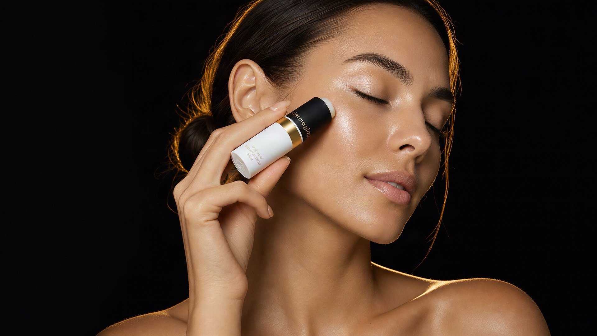 Applying the Dark Spots Eraser Balm to the cheekbone