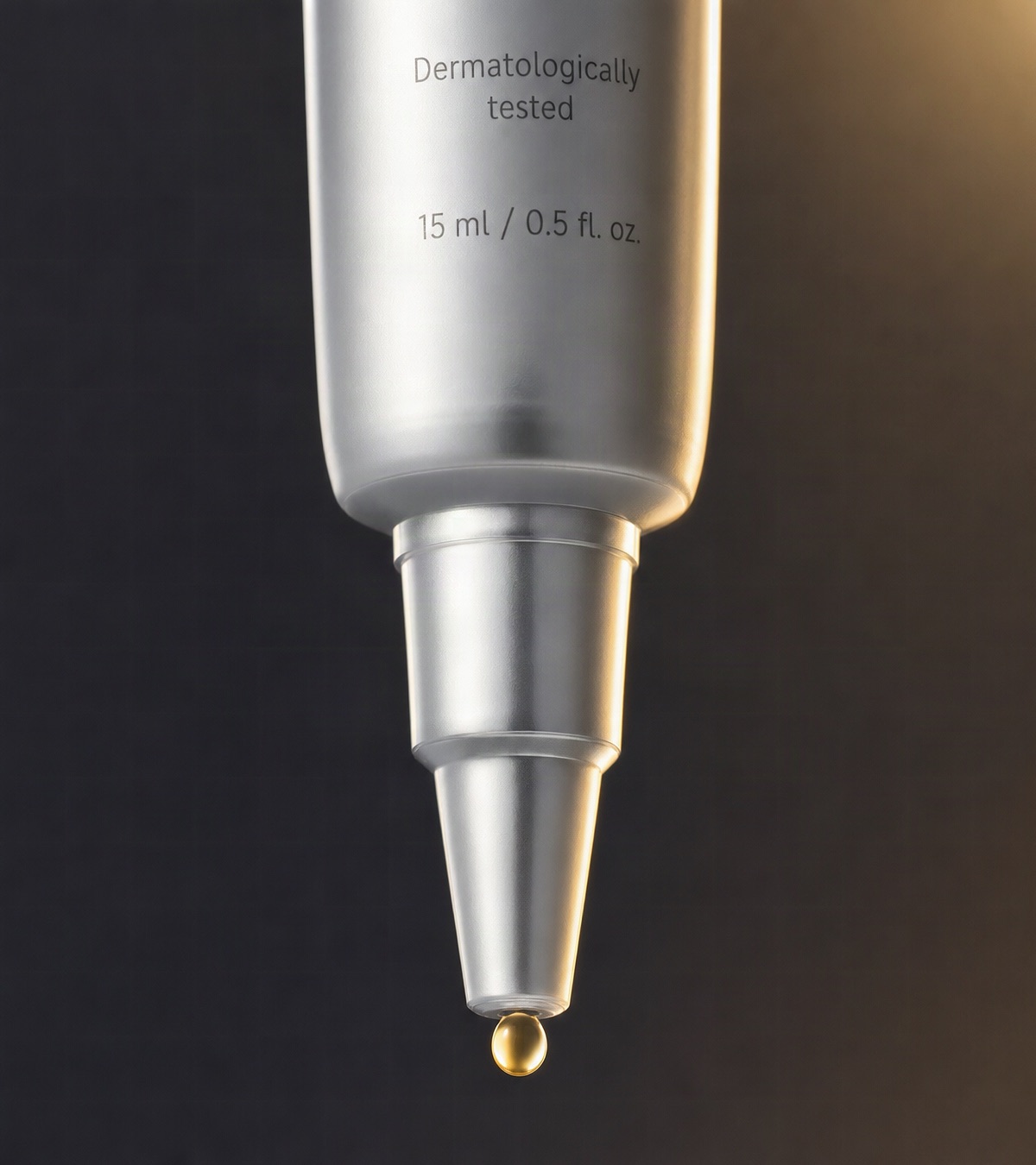 Precision tip dispensing a golden bead of serum